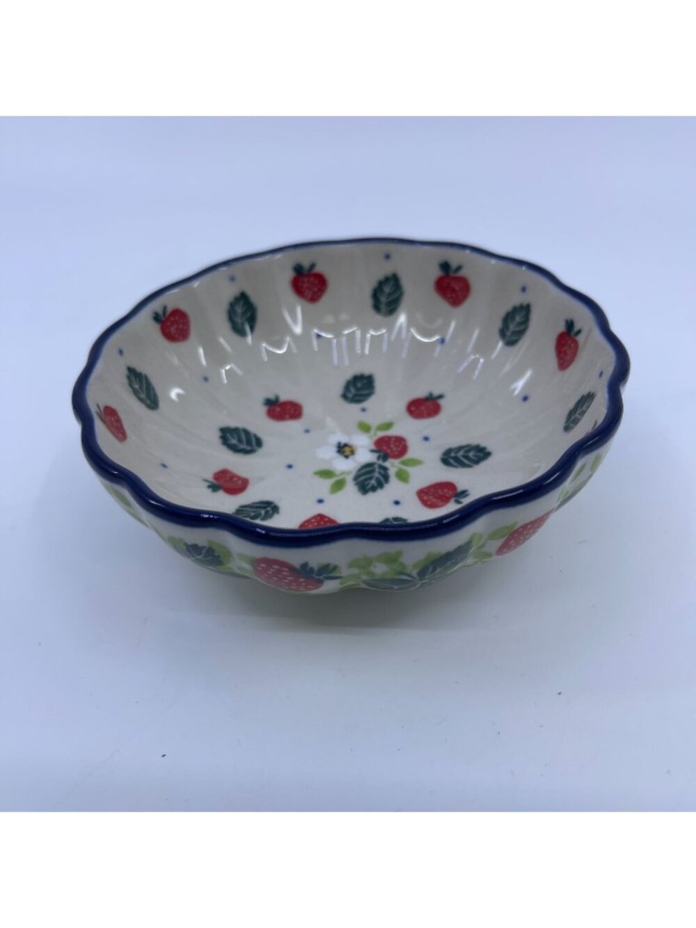 handmade polish pottery bowl with strawberry field pattern & scalloped edge